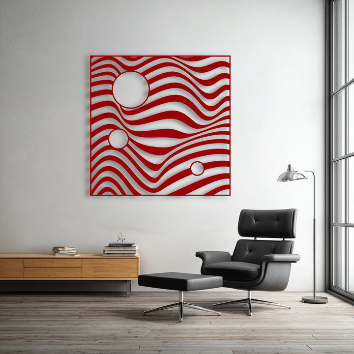 Square metal artwork features vibrant red undulating wave lines and bold circular geometric cutouts, creating a modern abstract design.