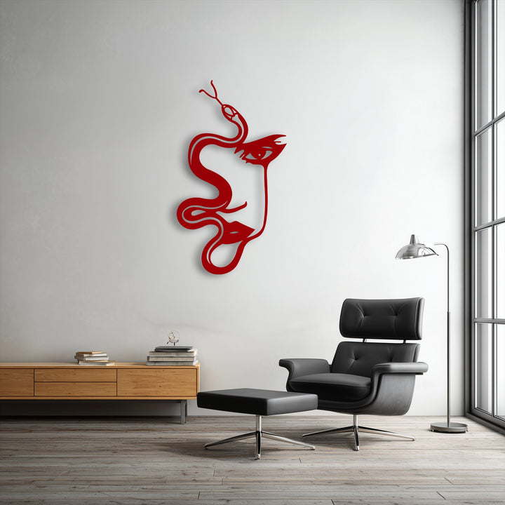 The brightly illuminated white wall showcases a captivating Abstract Woman & Serpent Silhouette metal wall decor.