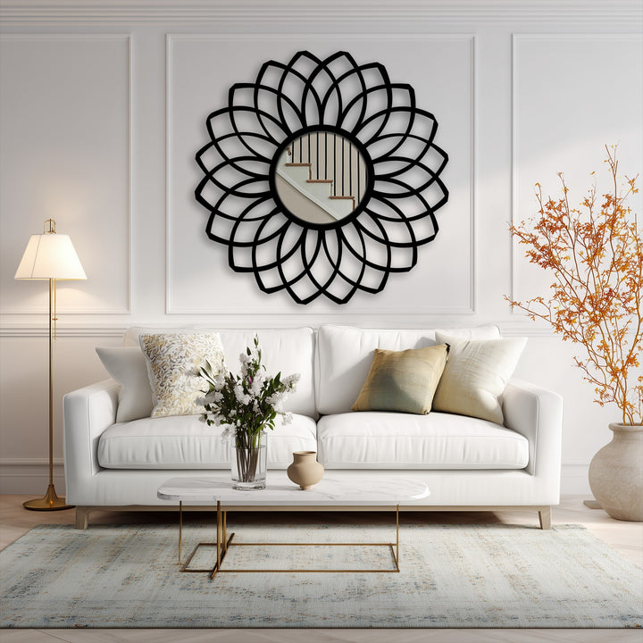 Subtle light and shadow play across the layered petal design of this black metal framed modern mirror, creating depth and visual interest.