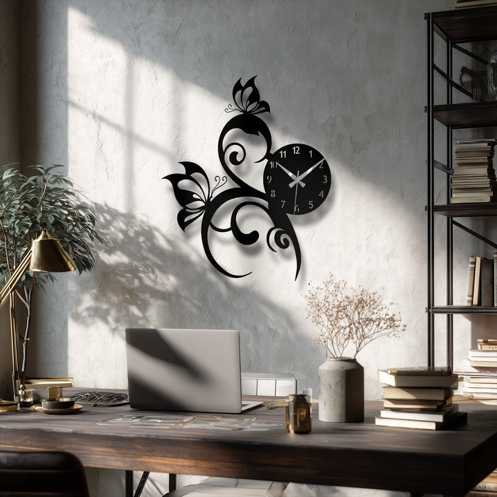 A matte black finish elevates the intricate butterfly vine metal wall clock, serving as stunning decoration wall art against a textured wall.