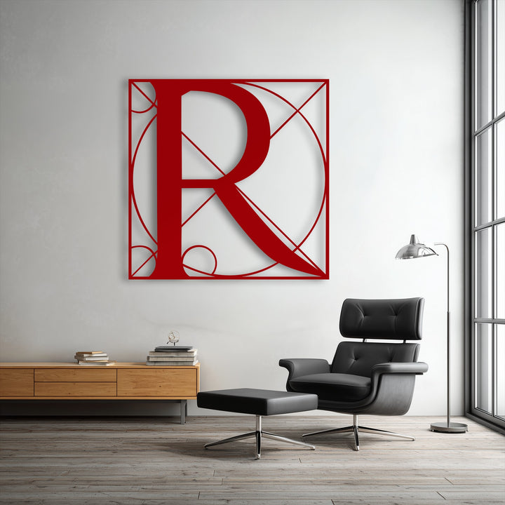 The striking red unique metal wall art depicting a geometric 'R' showcases a dynamic sense of movement through its intricate, flowing lines and bold arcs.