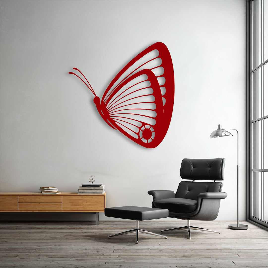 The soft black leather armchair and ottoman provide a comfortable seating area, complementing the elegant butterfly metal decoration wall art.