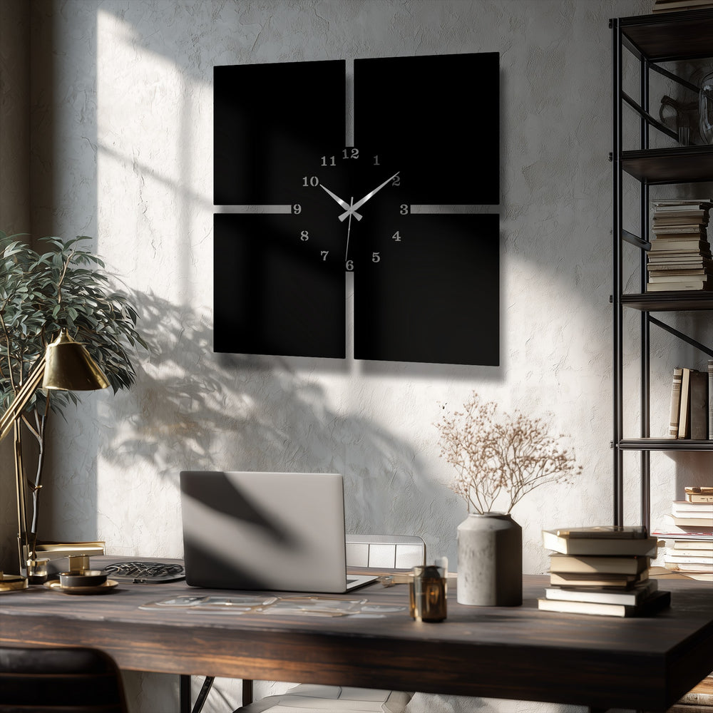 The material quality of this sleek decorative metal art is evident in its precisely crafted, minimalist four-panel wall clock design.