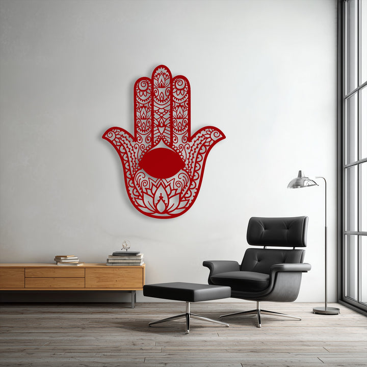 The bold transition from the vibrant red Hamsa Hand decorative metal art to the serene white wall creates a striking visual.