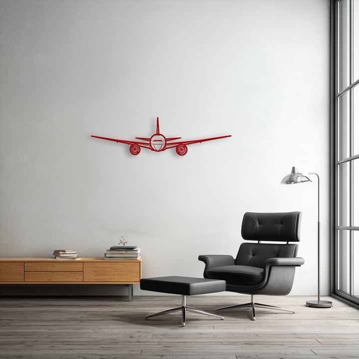 This horizontally oriented front view airplane silhouette, a striking piece of decorative metal art, offers an aviation theme.