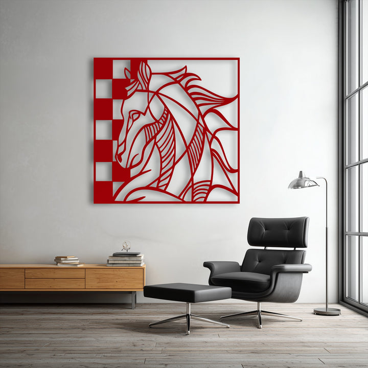 A stylish black leather armchair and matching ottoman sit on a light wooden floor, complementing a modern red horse decorative metal art.