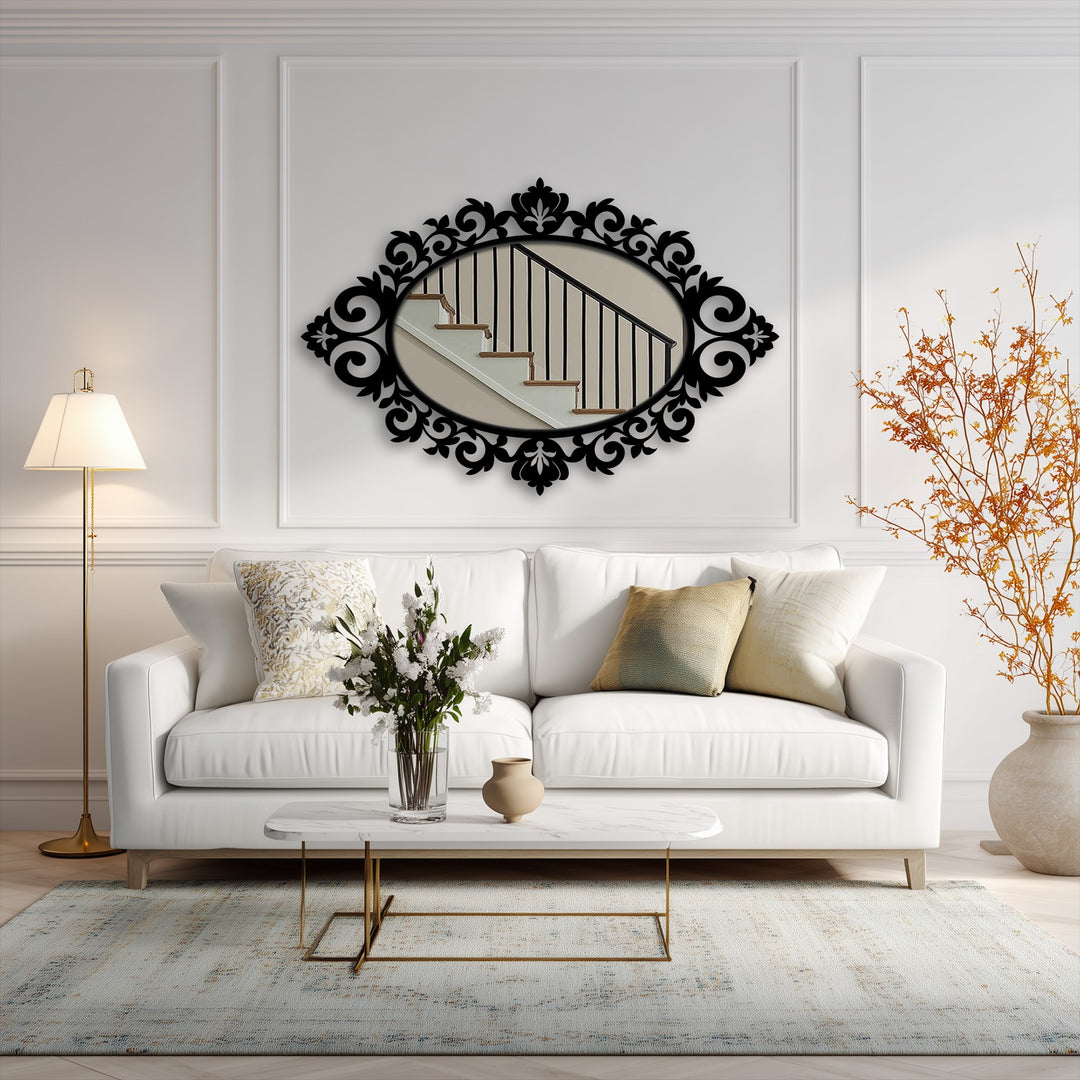 Foreground shows a stylish arrangement of a coffee table with flowers and a vase, enhancing the framed wall mirror reflecting a staircase in the background.