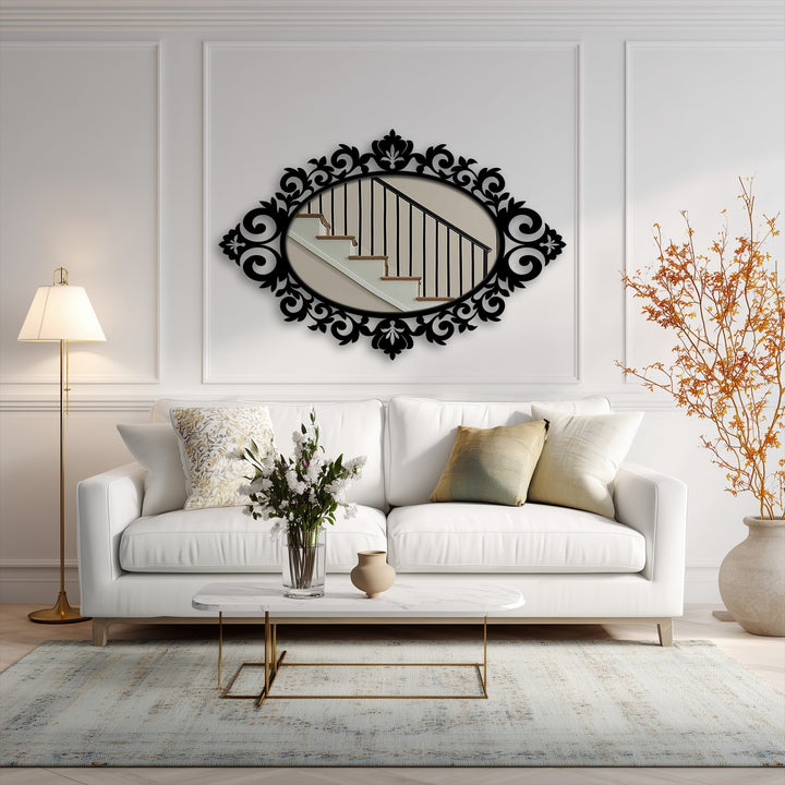 Foreground shows a stylish arrangement of a coffee table with flowers and a vase, enhancing the framed wall mirror reflecting a staircase in the background.