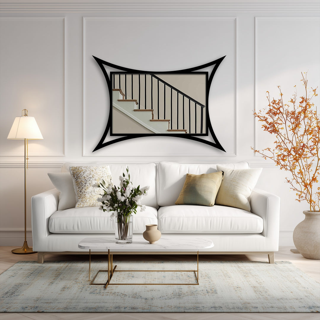 Curved edge frame highlights the staircase image in this striking piece of metal wall decor, a sculptural and modern statement for any room.