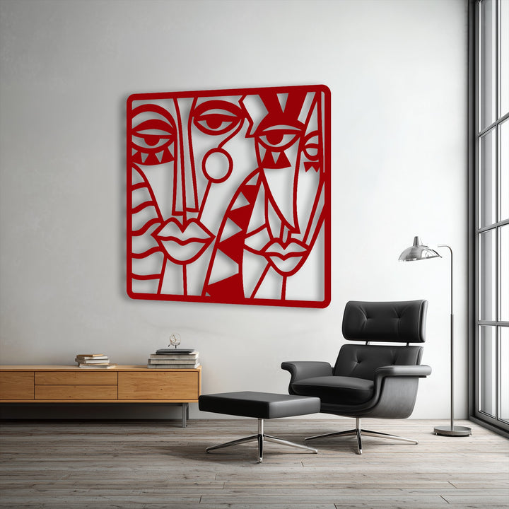 Striking color saturation highlights the bold red hues of this abstract faces modern cubist metal decoration wall art.