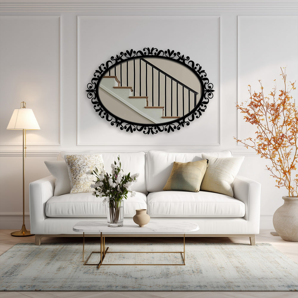 Softly illuminating the living room, the neutral rug provides a grounding complement to this ornate, oval framed wall mirror.