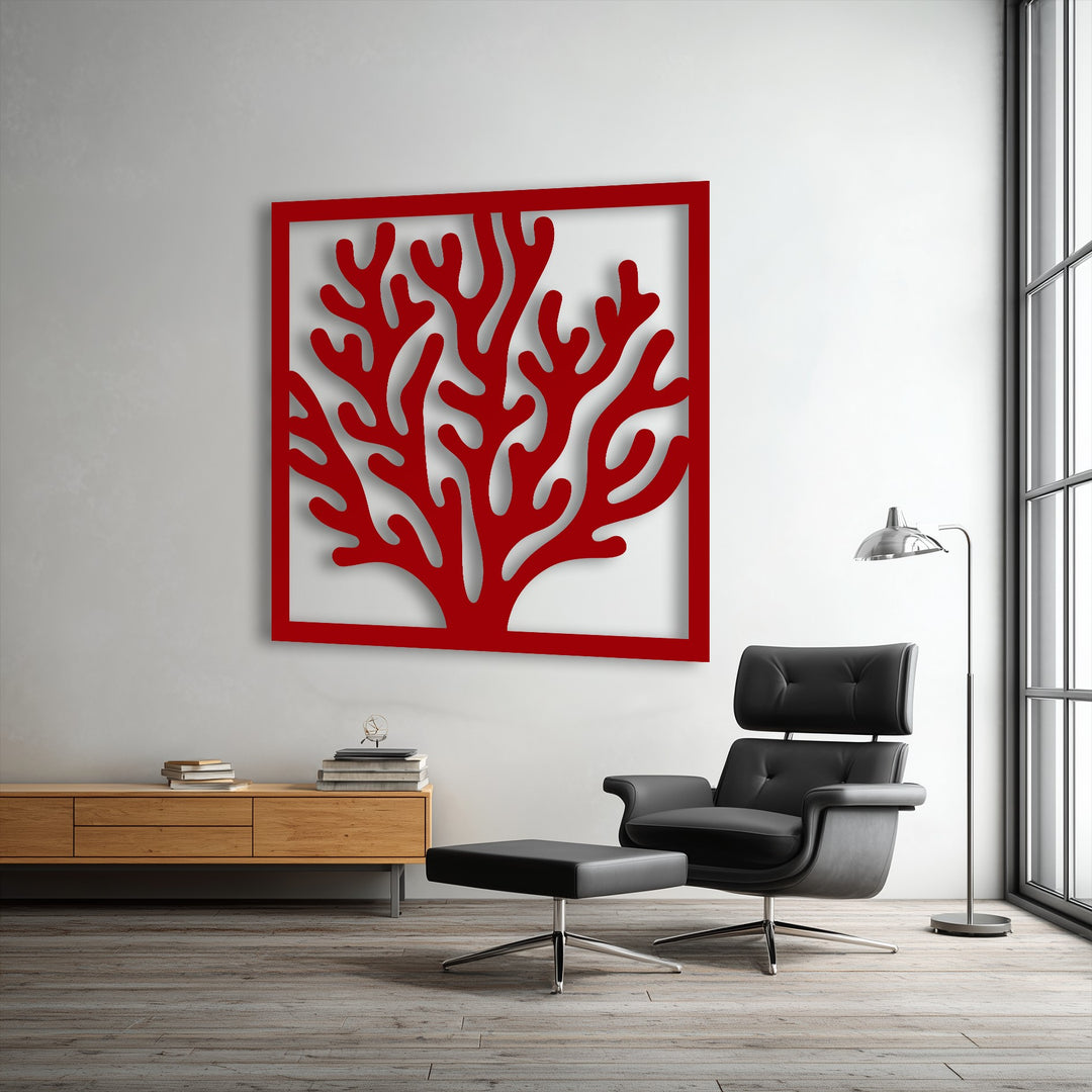 The vibrant red framed coral design stands out as a striking piece of unique metal wall art in a modern living space.