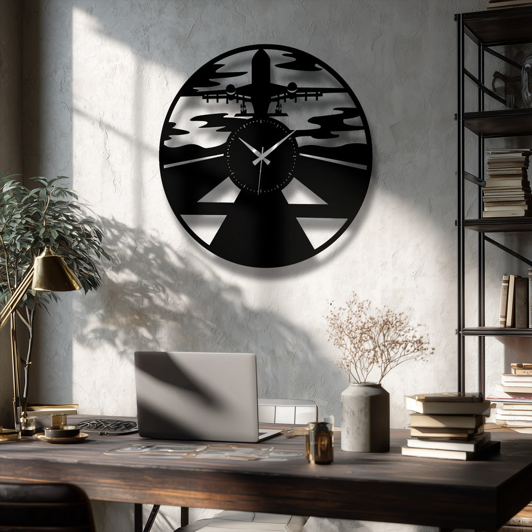 The deep wooden desk in the foreground, adorned with a laptop and a brass lamp, elegantly frames the aviation-inspired metal artwork.
