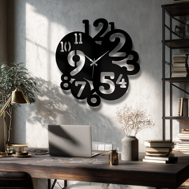 Featuring clean-cut edges and a sleek border, this modern overlapping numbers metal artwork wall clock boasts a contemporary design.