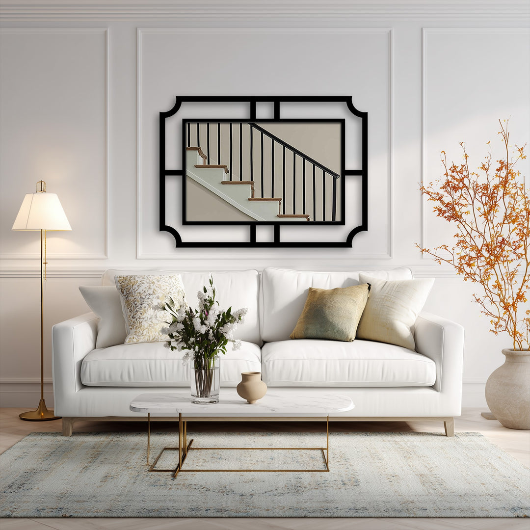 Gentle light graces the room, reflecting off the white sofa and emphasizing the unique metal wall art of the framed geometric wall mirror's minimalist design.