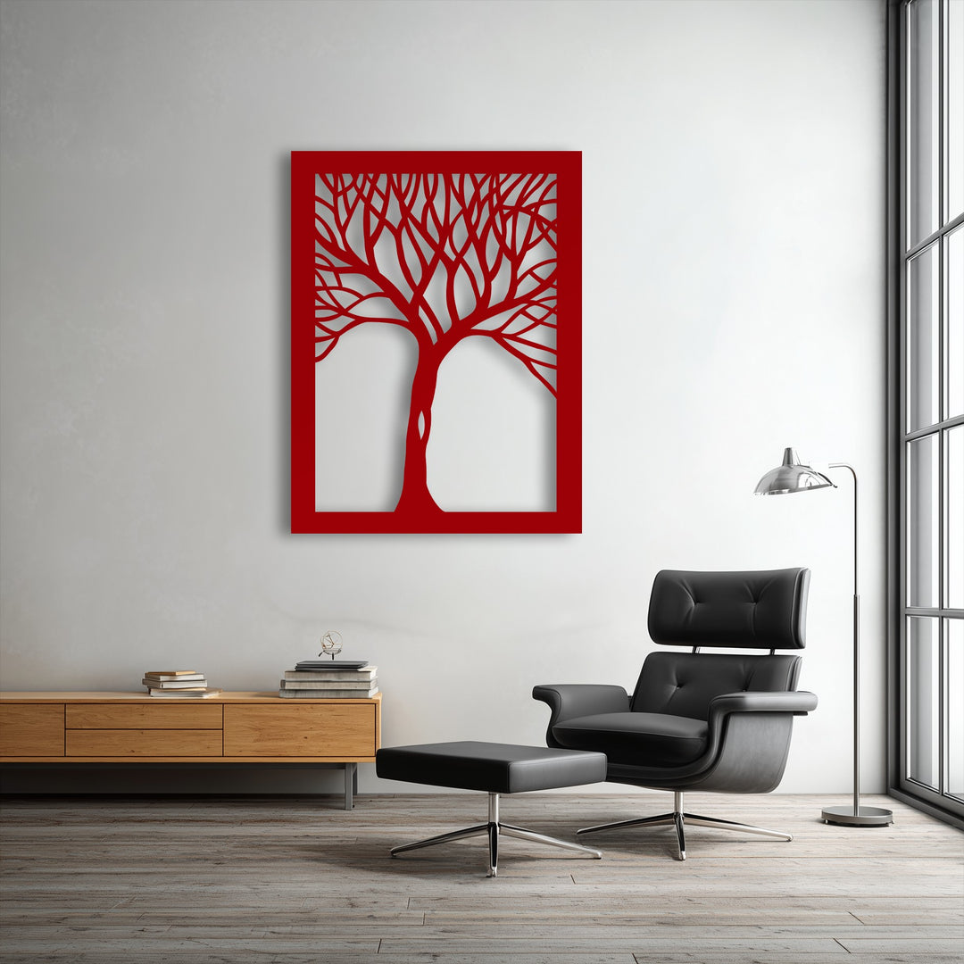 The soft black leather armchair provides comfort, beautifully contrasting the vibrant red abstract tree metal wall art, modern decoration wall art.