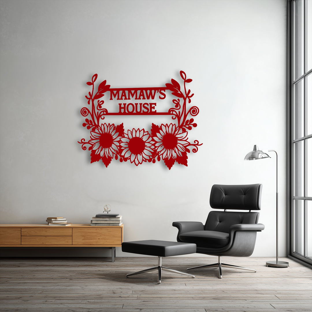 The personalized sunflower metal artwork features a vibrant red matte finish, forming a custom 'Mamaw's House' sign.