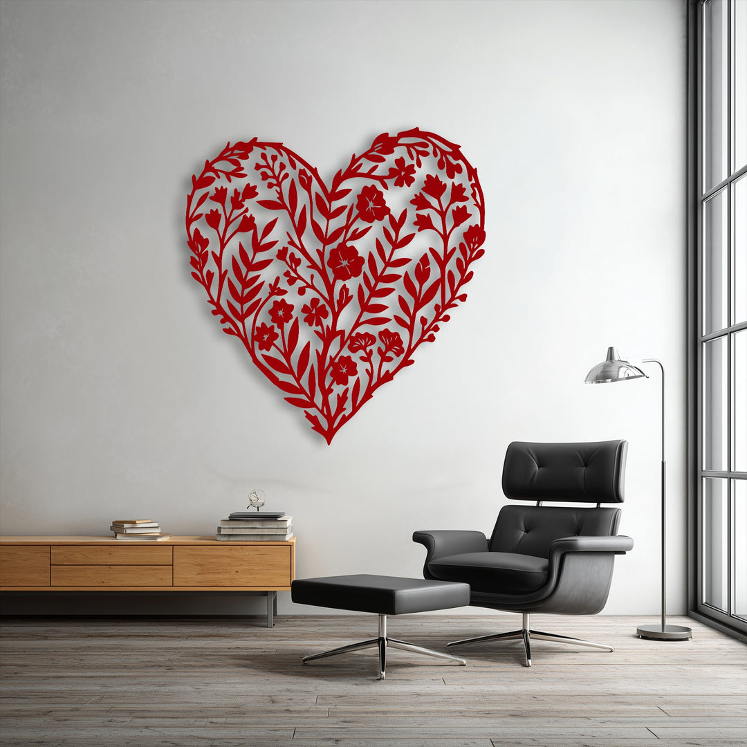 An intricate red botanical floral heart silhouette, serving as elegant metal art for wall decor, is the central subject.