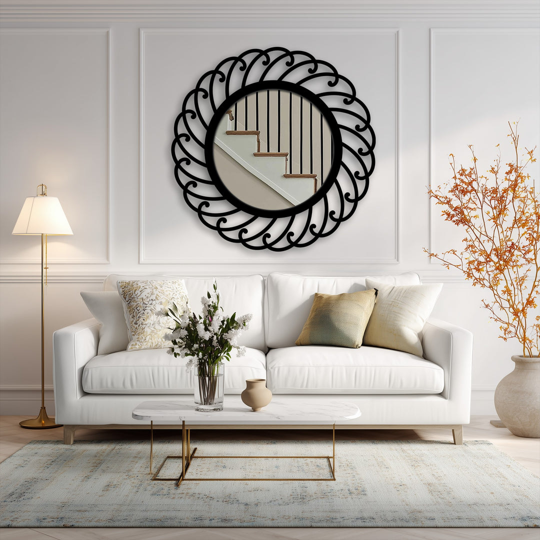 The bright, inviting mood is enhanced by a swirl pattern round metal wall mirror, reflecting stairs and providing a touch of decorative metal art.