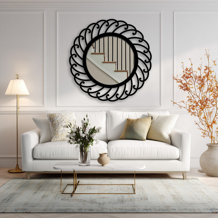The bright, inviting mood is enhanced by a swirl pattern round metal wall mirror, reflecting stairs and providing a touch of decorative metal art.