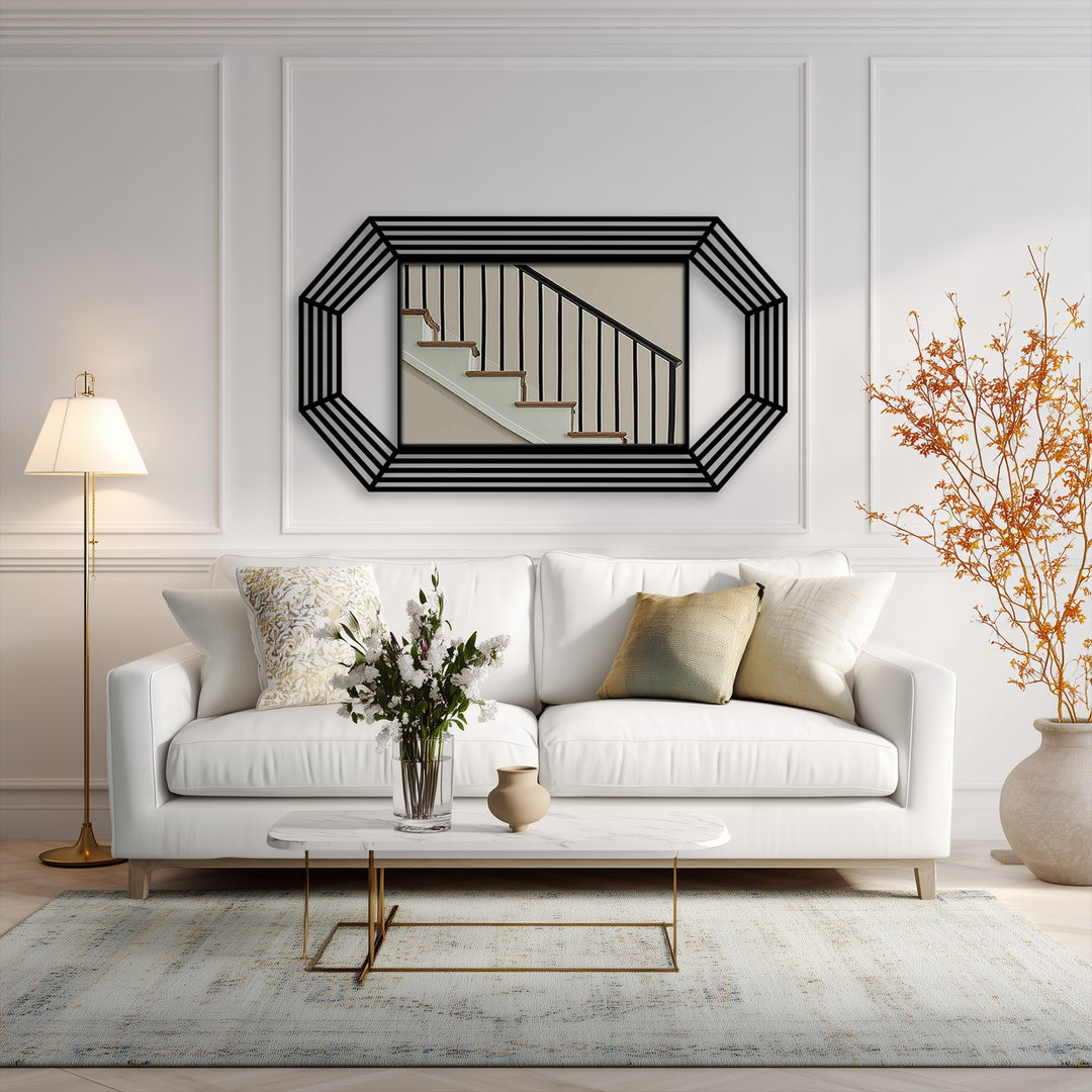Against the bright white wall, the octagonal mirror for wall decor displays a staircase scene, offering a contrasting focal point within the minimalist setting.