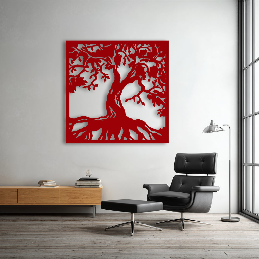 A sophisticated black leather armchair and ottoman anchor a modern living space featuring vibrant red tree silhouette decoration wall art.