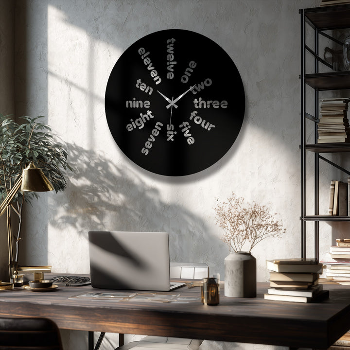 Circular decoration wall art, a metal wall clock, displays a modern typography design with text representing the time in a unique, round orientation.