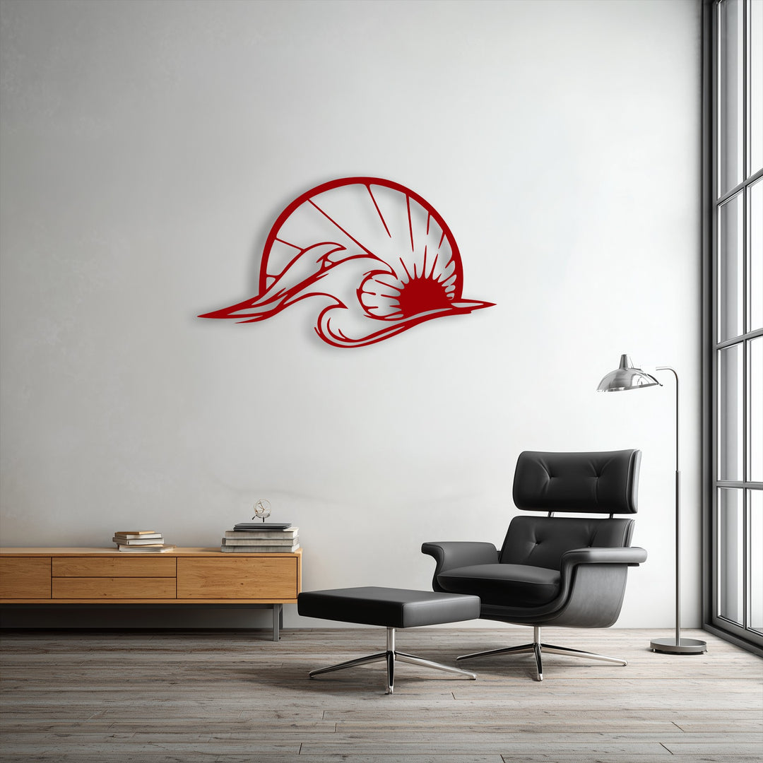 The plush black leather armchair provides a striking contrast to the dynamic red ocean wave and dolphin metal wall decor.