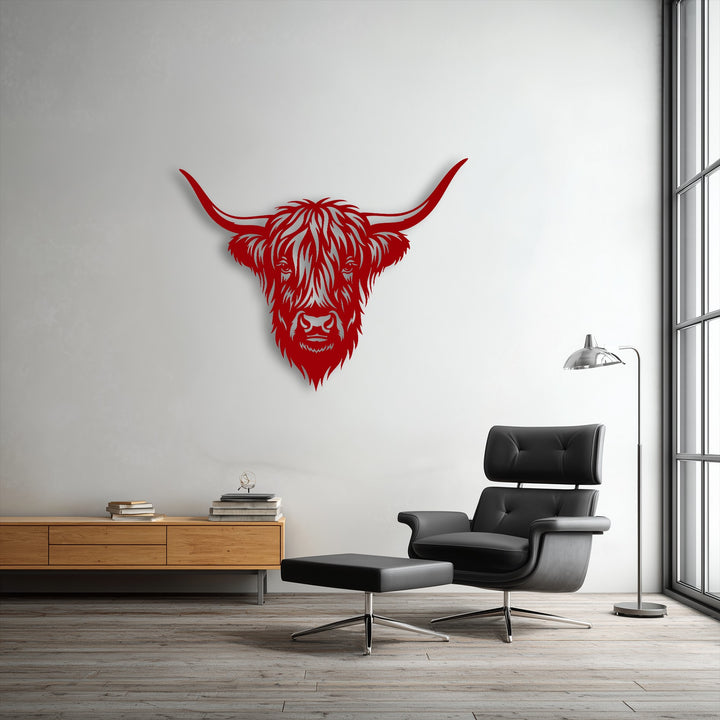 With vibrantly saturated red hues, this striking Highland Bull Head metal decoration wall art stands out against the muted wall.