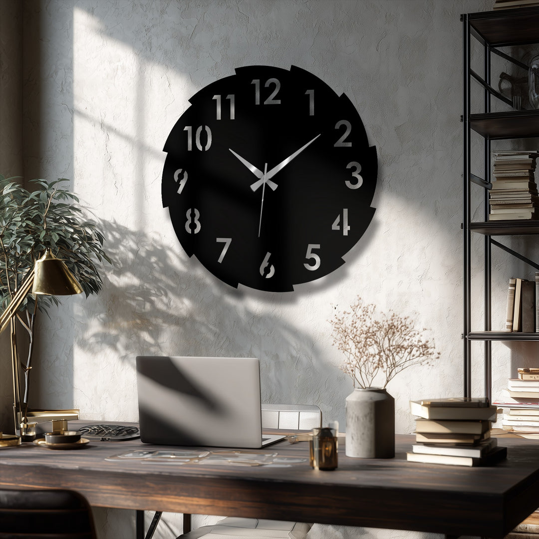 Featuring a sleek black finish, this segmented modern number design displays attractive metal wall decor as a focal point above a desk.