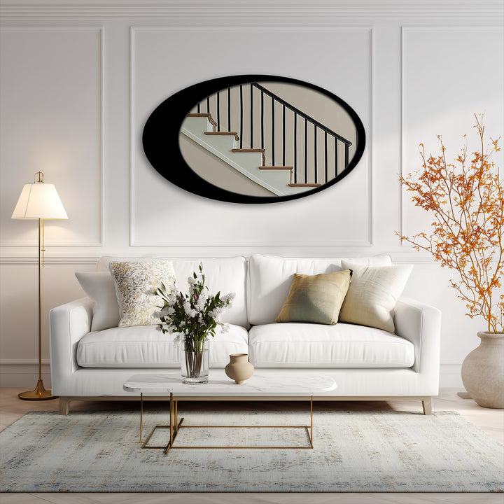 Evoking a serene mood, this minimal oval floor mirror with a sleek black frame presents a compelling example of metal art for wall, enhancing the room's soft, elegant ambiance.