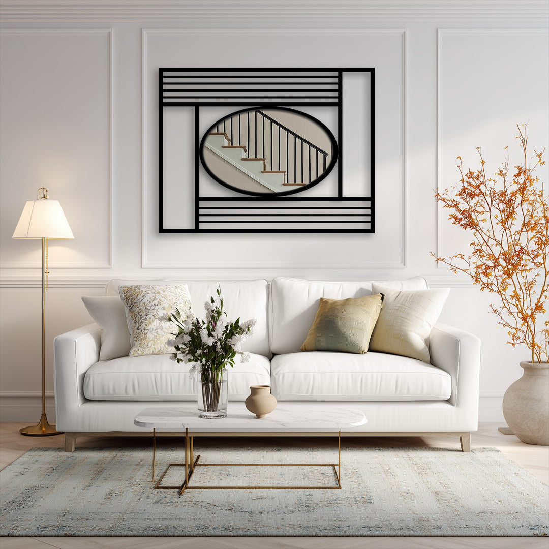 Horizontally oriented square featuring distinctive metal artwork with an oval mirror showcasing an interior staircase scene.
