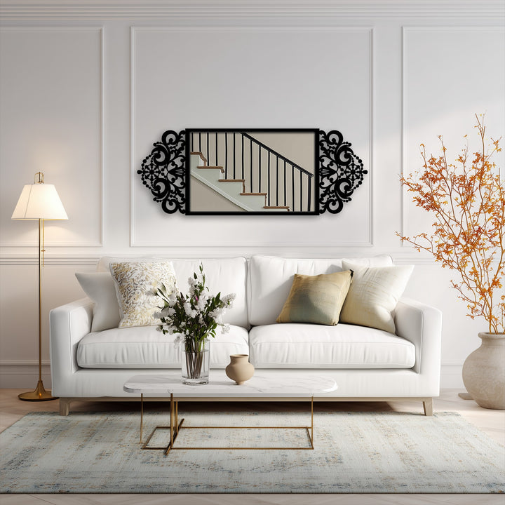 Highlighting the strong color contrast, this ornate baroque scroll frame offers a modern mirror experience with an elegant black metal wall decor design against the light backdrop.