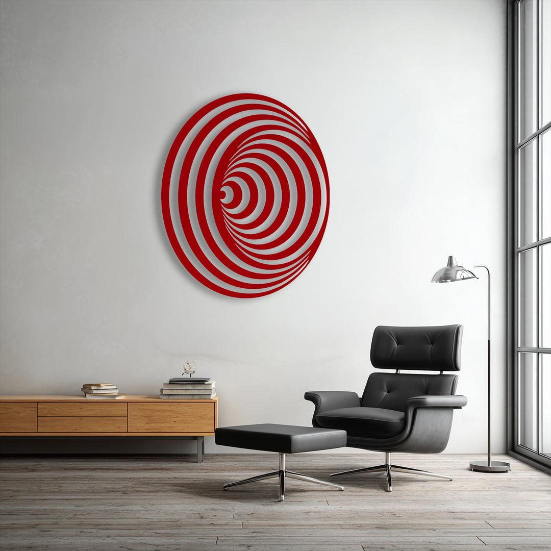 The smooth, uniform surface texture of the red spiral metal artwork contrasts with the lighter recesses, forming a captivating geometric illusion.