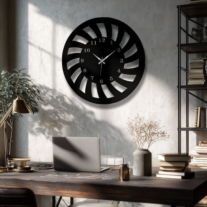 The striking black spiral-motion clock, a piece of decorative metal art, stands out with its modern dynamic design as the room's focal point.