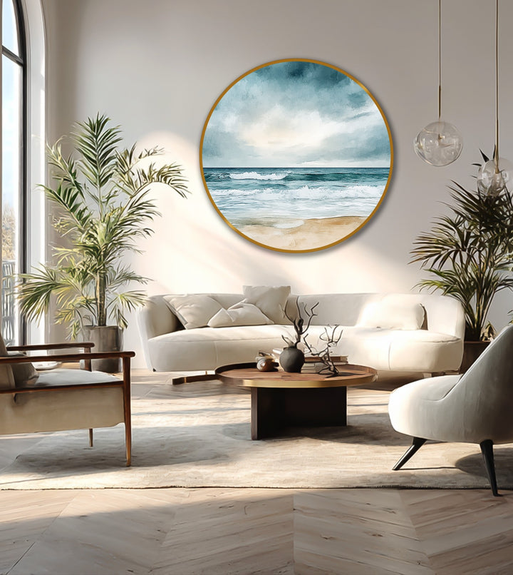 Round oil painting art piece features a circular canvas with a beach horizon scene, complementing the room's rectangles and curved furniture designs.