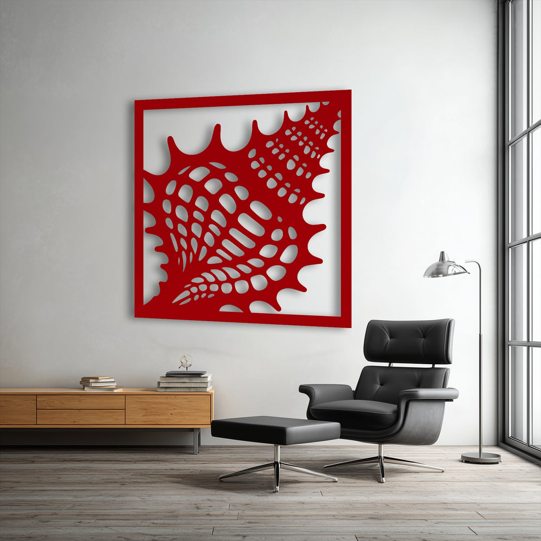 The stillness of the contemporary space is highlighted by the detailed red seashell metal wall decor above a minimalist wooden console.