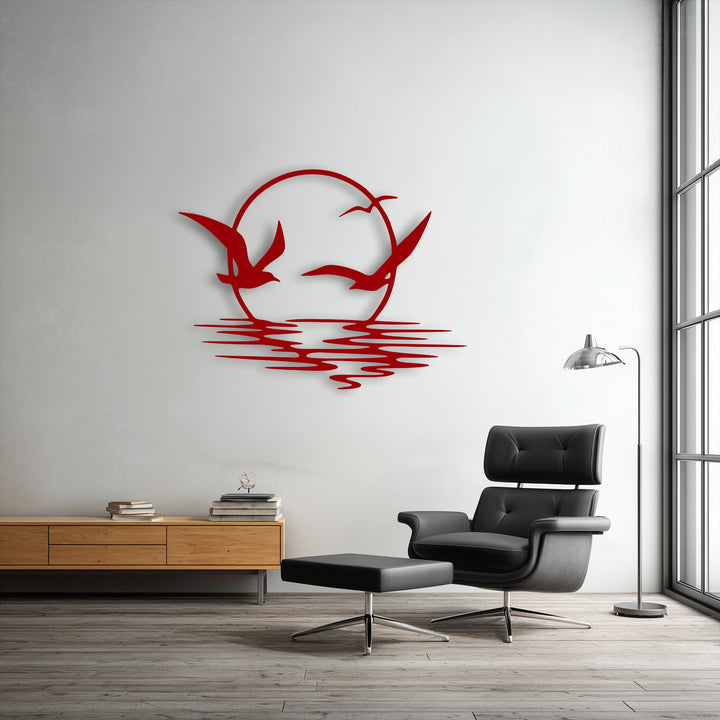 Realistic detail is evident in the vibrant crimson decorative metal art depicting soaring seagulls and a setting sun over ocean waves.