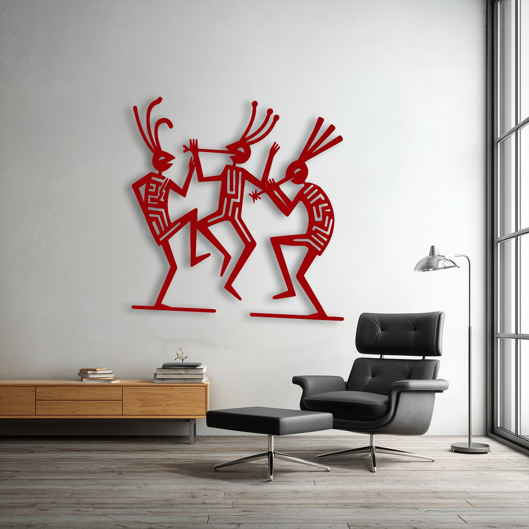 The vibrant red finish of the tribal dance figures metal art for wall showcases intricate patterns and a smooth matte texture.
