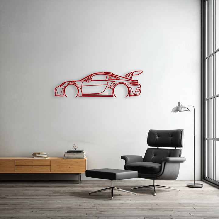 The red decorative metal art of a sport car outline pops off the white wall as the loudest element in this modern interior scene.