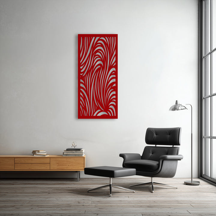A sleek black leather armchair and matching ottoman furnish the foreground, complementing the abstract wave pattern metal wall decor.