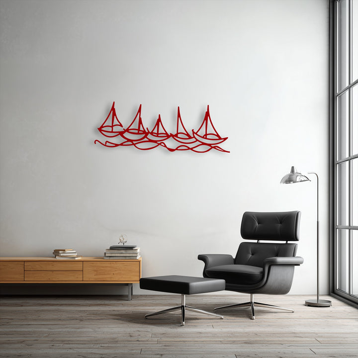 Organic forms of red, stylized sailboats gracefully ride flowing waves, creating a captivating unique metal wall art piece.