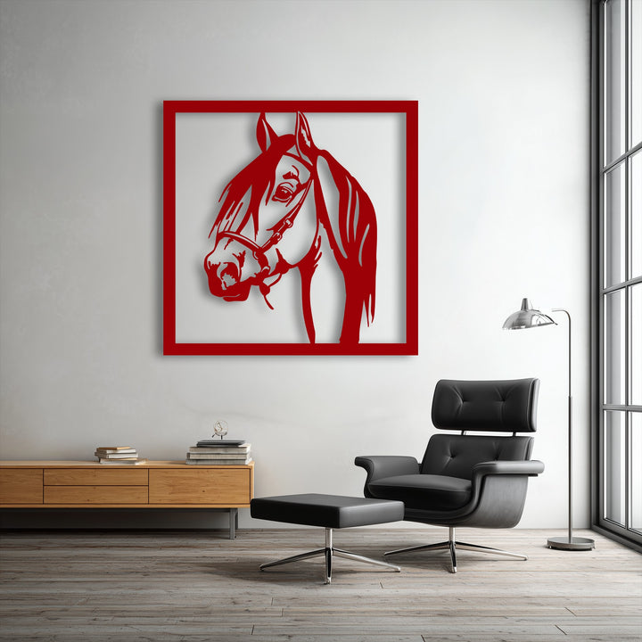 The striking red finish of the unique metal wall art depicts a graceful stallion portrait, creating a bold, modern focal point.