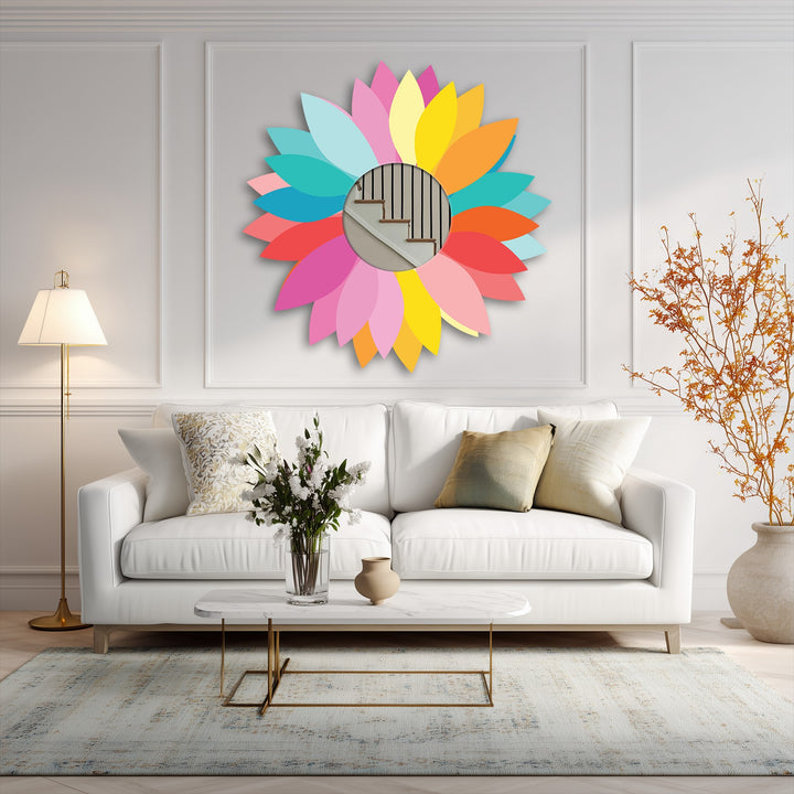 Light and shadow play across the colorful petals of this round, floral design metal wall decor, creating depth and highlighting its vibrant, modern appeal.