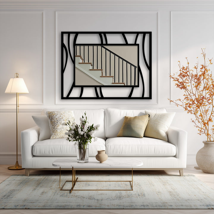 Black decorative metal art finish accentuates the abstract wave frame in this stylish metal wall mirror, creating a modern fluid line design.