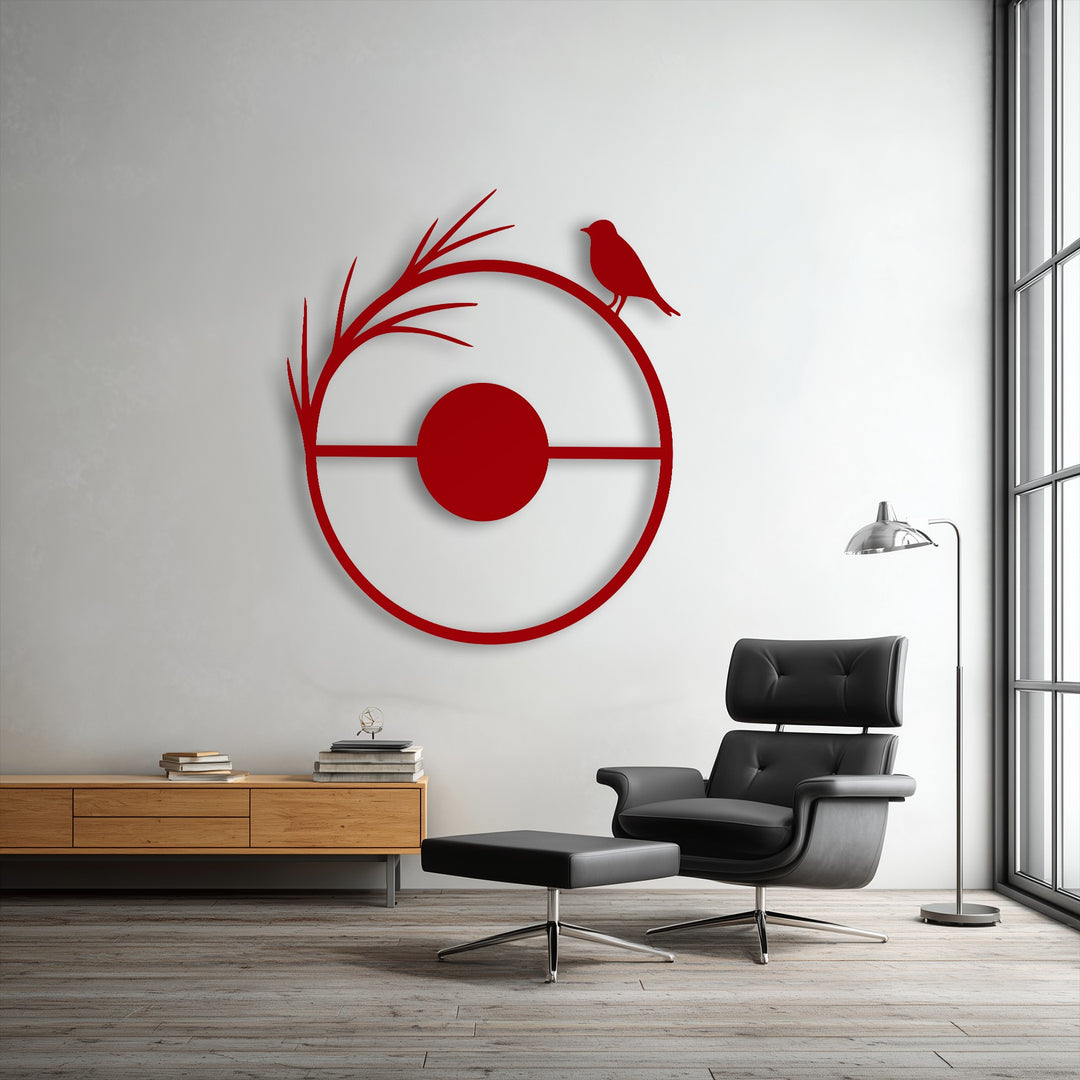 A striking circular unique metal wall art piece, horizontally oriented, depicts a minimalist red bird on a branch.