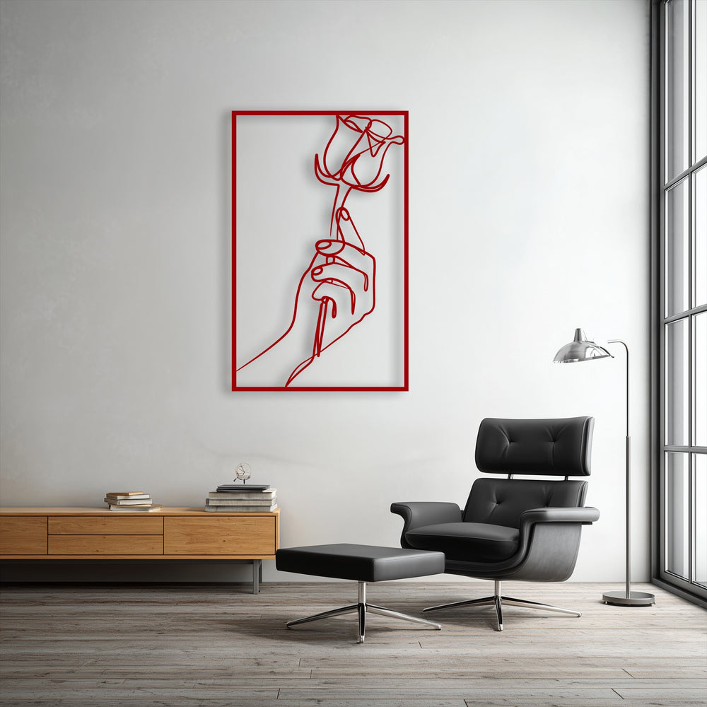 The visual rhythm of the striking red line art metal art for wall, depicting a minimalist hand holding a rose, brings elegant flow to the modern room.