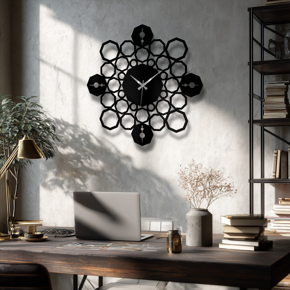 A striking black geometric mandala metal wall clock with a modern symmetrical design serves as stylish decoration wall art on a textured wall.