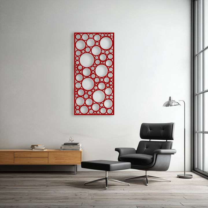 Geometric elements of the red abstract metal art for wall feature numerous interlocking circles of varying sizes, creating a dynamic pattern.