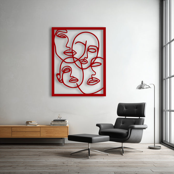 A smooth, light gray wall provides a crisp, minimalist background for the Abstract Faces Line Art metal wall decor.
